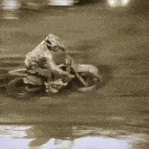 a close up of a person riding a motorcycle