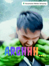 a blurry picture of a man with the word arghhhh written on it
