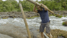 Carrying A Log Primal Survivor5 GIF - Carrying A Log Primal Survivor5 Survival Skills GIFs