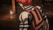 a person with blue and white stripes on their body has the letter l on the back of their shirt