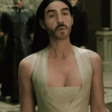 a man with a beard wearing a white dress made with reface app