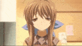 a girl with long brown hair is wearing a plaid turtleneck and apron