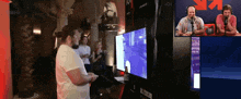 a man playing a video game in front of a screen that says 101 on it
