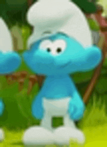 a couple of smurfs standing next to each other in a field .