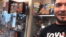 a man wearing a black t-shirt that says tovl
