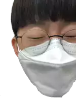 a person wearing glasses and a white face mask