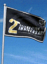 a black flag with the number 2 on it is flying in the wind