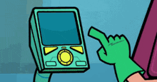 a person in a green glove is pointing at a device with buttons on it .