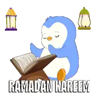 a blue and white penguin reading a book with the words ramadan kareem written below it