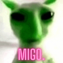 a close up of a green alien with the word mico on the bottom