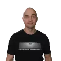 a bald man wearing a black shirt that says ' stadium ' on it