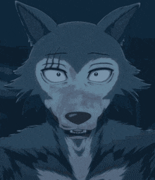 a close up of a wolf 's face with its tongue out