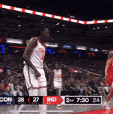a basketball game is being played with the score being 27 to 24