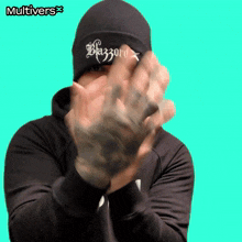 a man wearing a black beanie that says blazoro