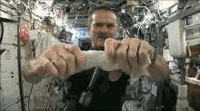 Wringing A Cloth In Space GIF