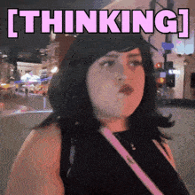 a woman standing on a street with the word thinking above her head