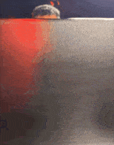 a blurred image of a person 's face behind a glass