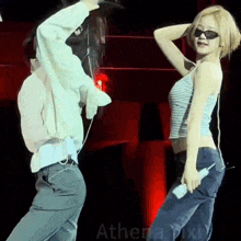 a man and a woman are dancing together on a stage .