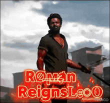 a man is holding a sword in front of a fire with the words roman reigns leo written on it .