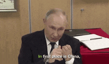 a man in a suit and tie is saying in first place is china .