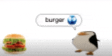 a penguin is standing next to a hamburger that says burger