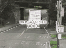 a world wide moving truck is driving down the road