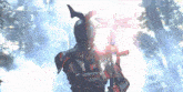 a person in a futuristic armor is holding a sword in a forest .