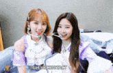 two girls are posing for a picture and the words let 's kcontact are visible