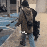 a drawing of a person walking with the name liiva on the bottom