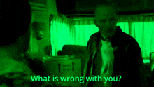 a man standing next to a box with the words what is wrong with you