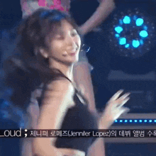 a close up of a woman dancing on a stage with a caption that says jennifer lopez .