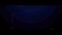 a blurred image of red , pink and blue lights on a dark background .