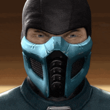 a man wearing a blue mask and a black hood