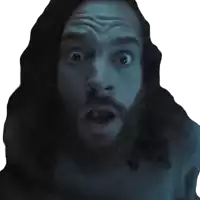 a man with long hair and a beard looks surprised