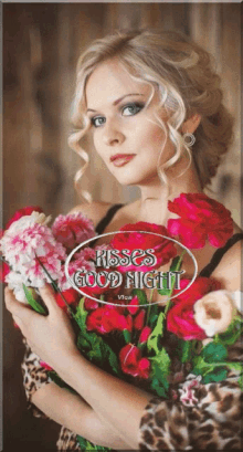 a woman holding a bouquet of red roses with roses good night on the bottom