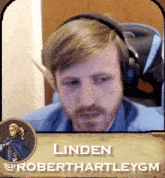 a man wearing headphones with linden robert hartleygm written on the bottom