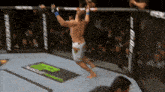 a man is jumping over a fence in a boxing ring with the word ufc on it