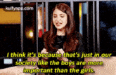 a woman is sitting on a couch and talking about a society like the boys are more important than the girls