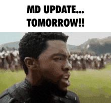 a man is standing in front of a crowd and says md update tomorrow !!