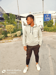 a man wearing a grey aero restro hoodie