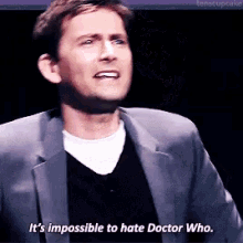 a man in a suit is saying it is impossible to hate doctor who