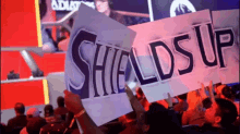 la gladiators fans hold your sign shields up