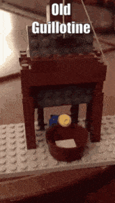 a lego model of an old guillotine is on a table