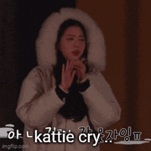 a woman wearing a white coat with a fur hood is crying with tears coming out of her eyes
