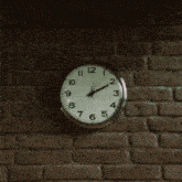 a close up of a clock with roman numerals shows the time as 5:05