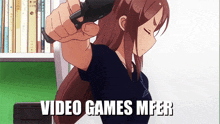 a girl is holding a video game controller with the words video games mfer written below her