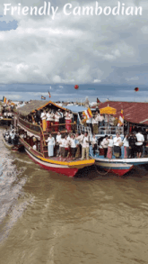 a group of people on a boat with the words friendly cambodian below them