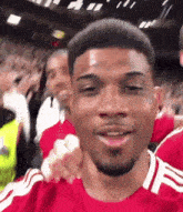 a man in a red shirt with the letter f on the front