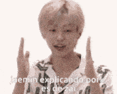 a man is making a funny face with his hands in the air while talking about pork .