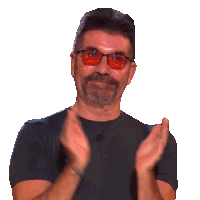a man with a beard wearing sunglasses is clapping his hands